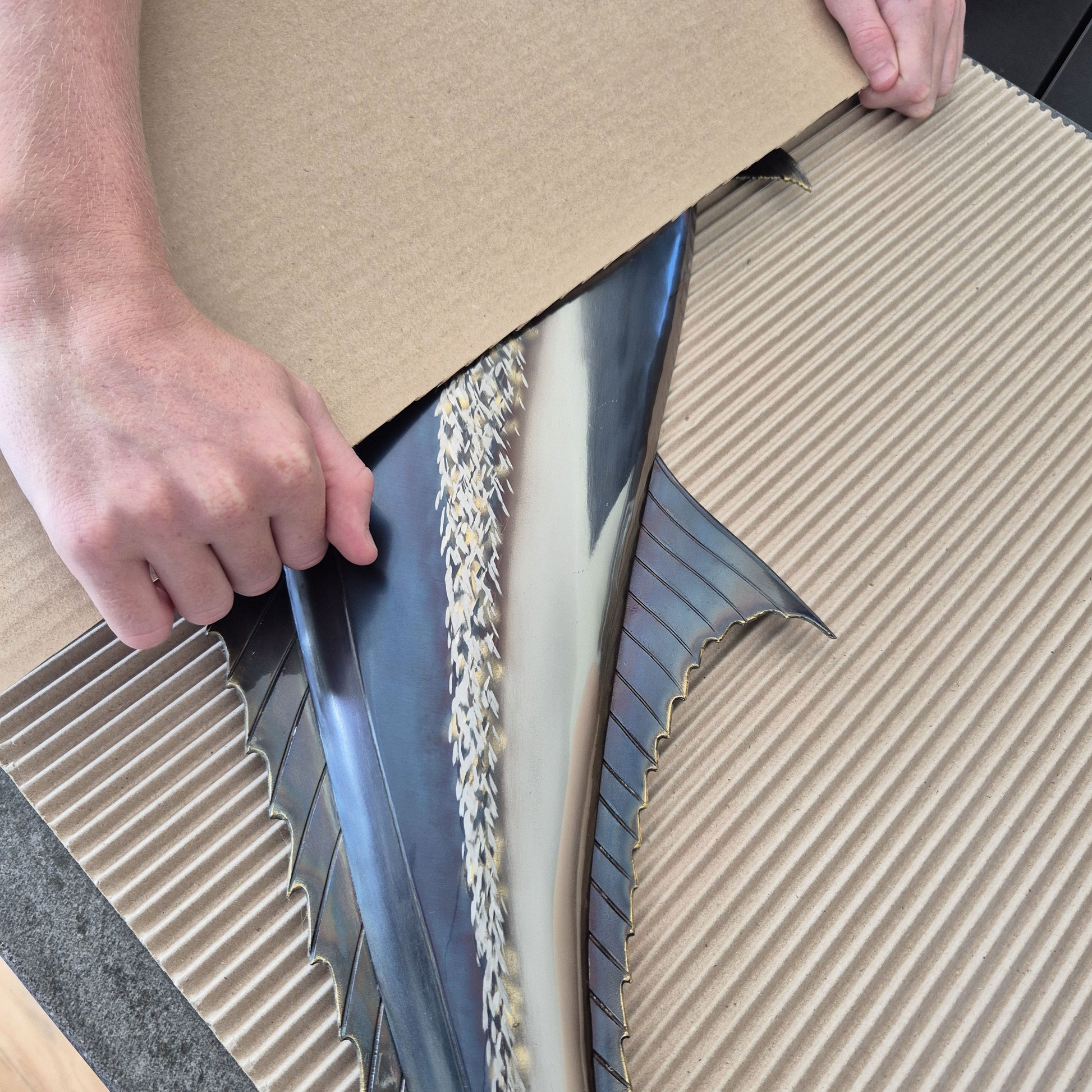 protect your fragile items during moving with a roll of cardboard.